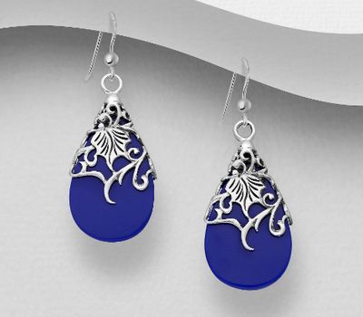 Sterling silver raindrop earrings with floral patterns and set with reconstructed stones.