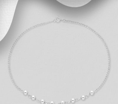 Sterling silver anklet decorated with eight small silver balls.